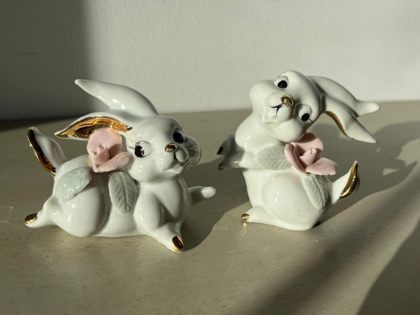 Vintage pair of white porcelain bunny rabbits, pink flowers & gold trim