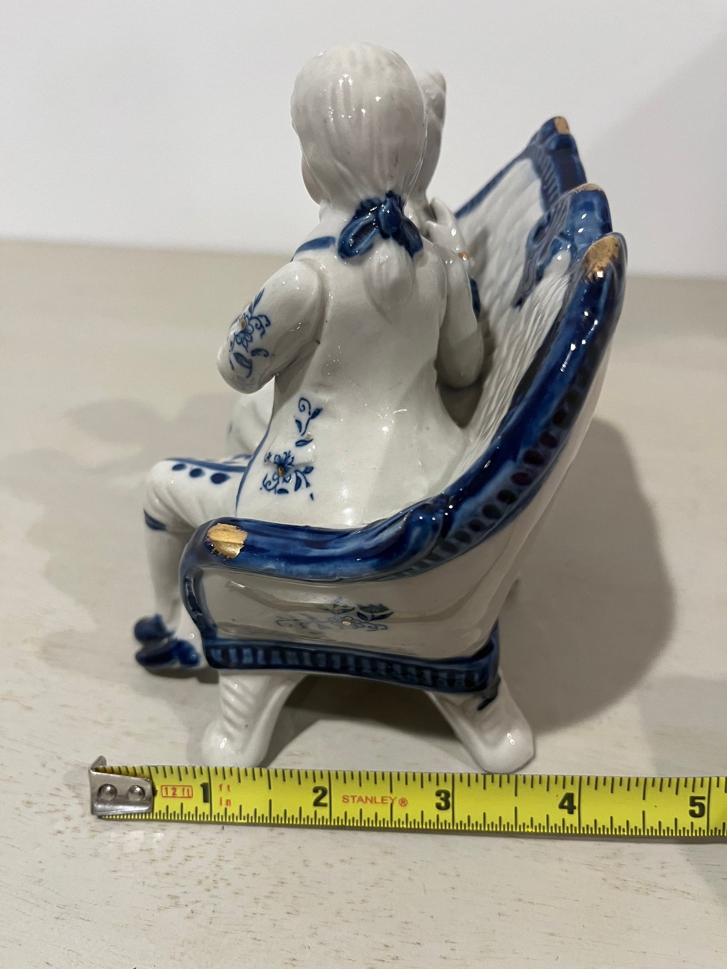 Vintage porcelain blue and white figurine of a courting 18th century couple