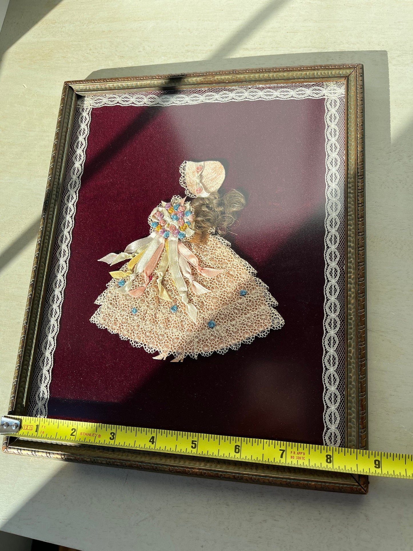 1930s paper and fabric framed doll