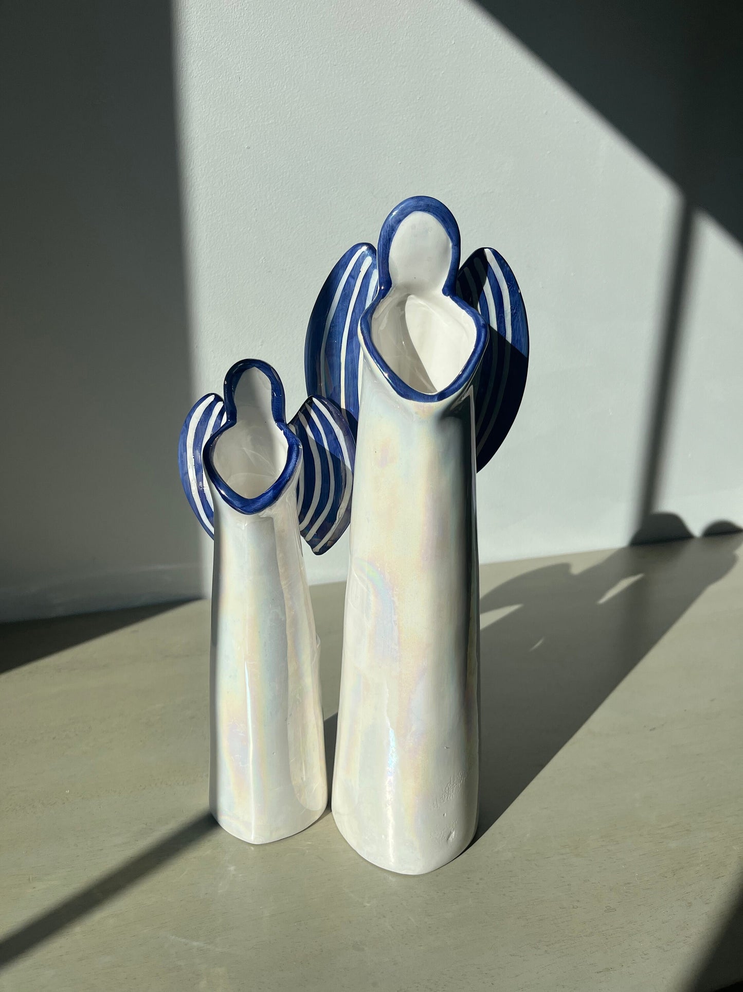 Pair of vintage iridescent glass blue pearl 12 & 9.5 inch angel candle holders