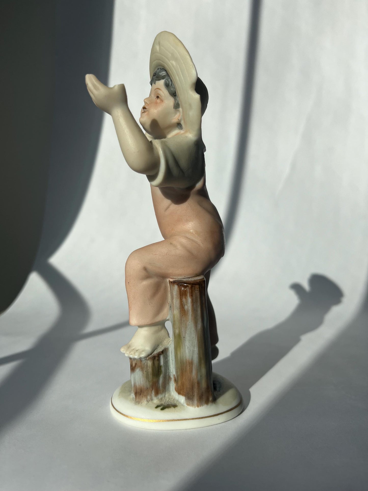 Vintage ceramic figurine of a boy, made in Japan