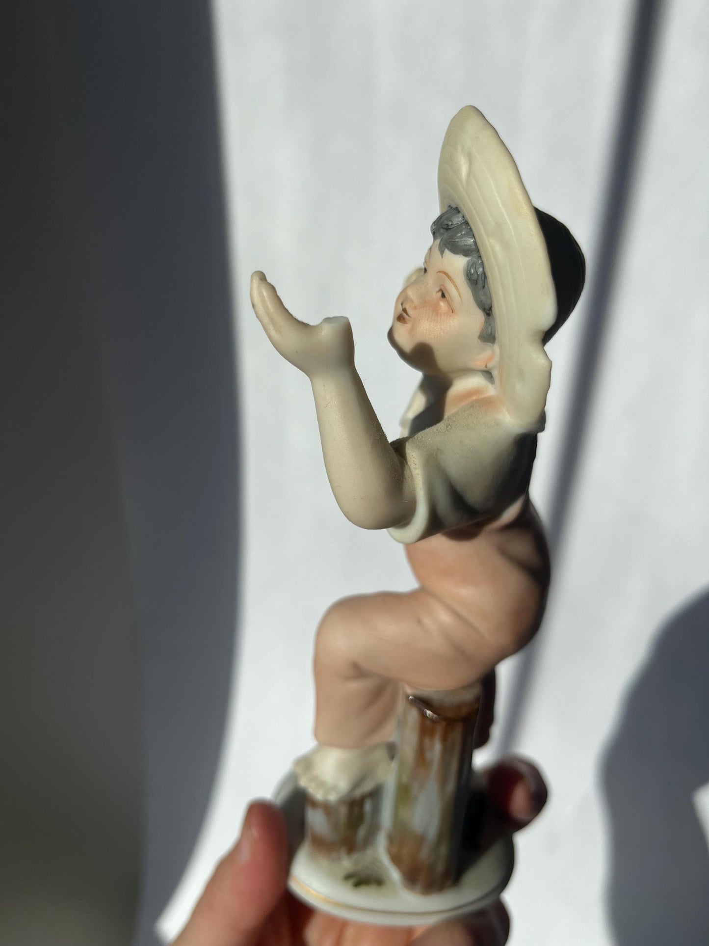 Vintage ceramic figurine of a boy, made in Japan