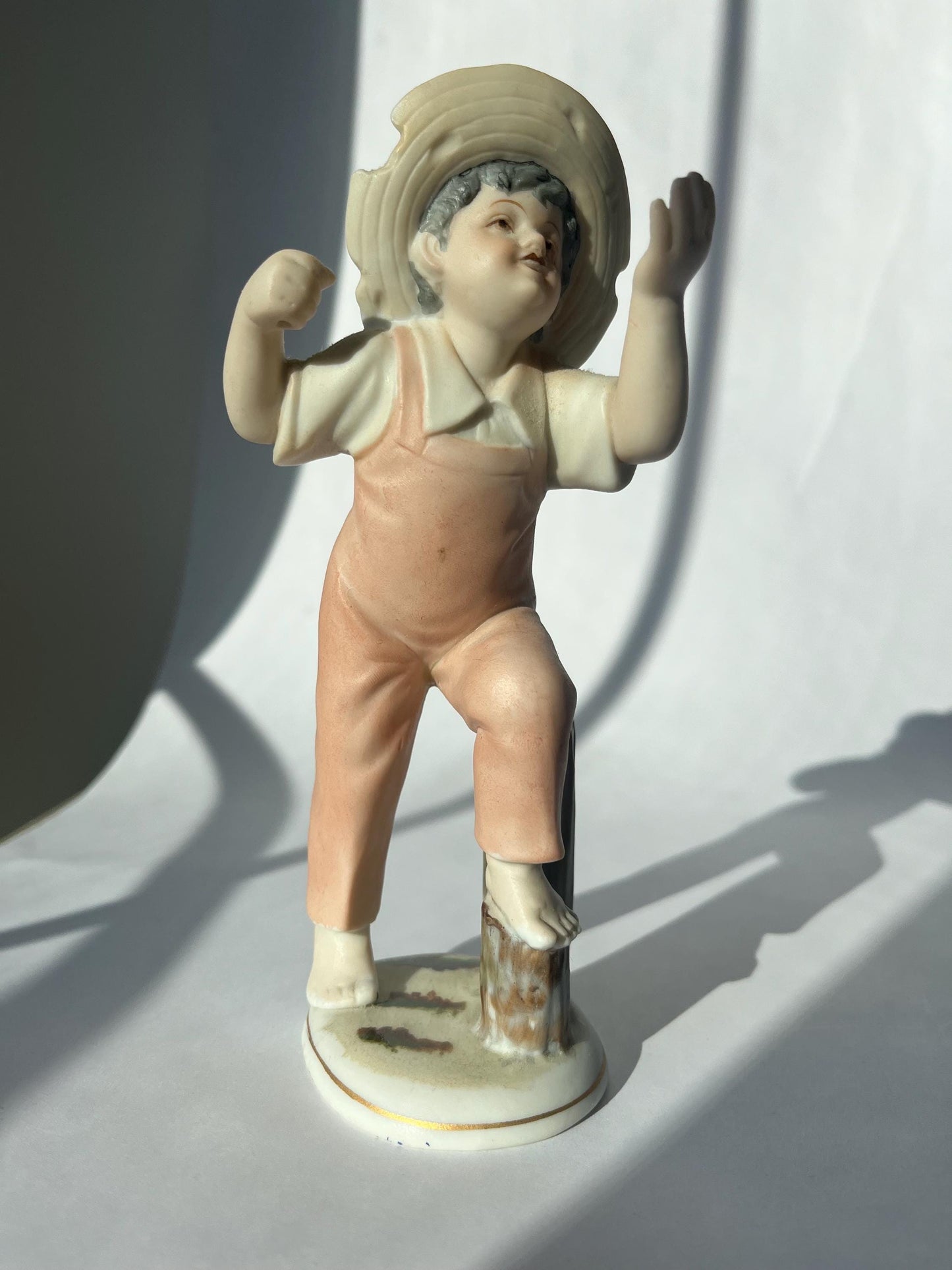 Vintage ceramic figurine of a boy, made in Japan