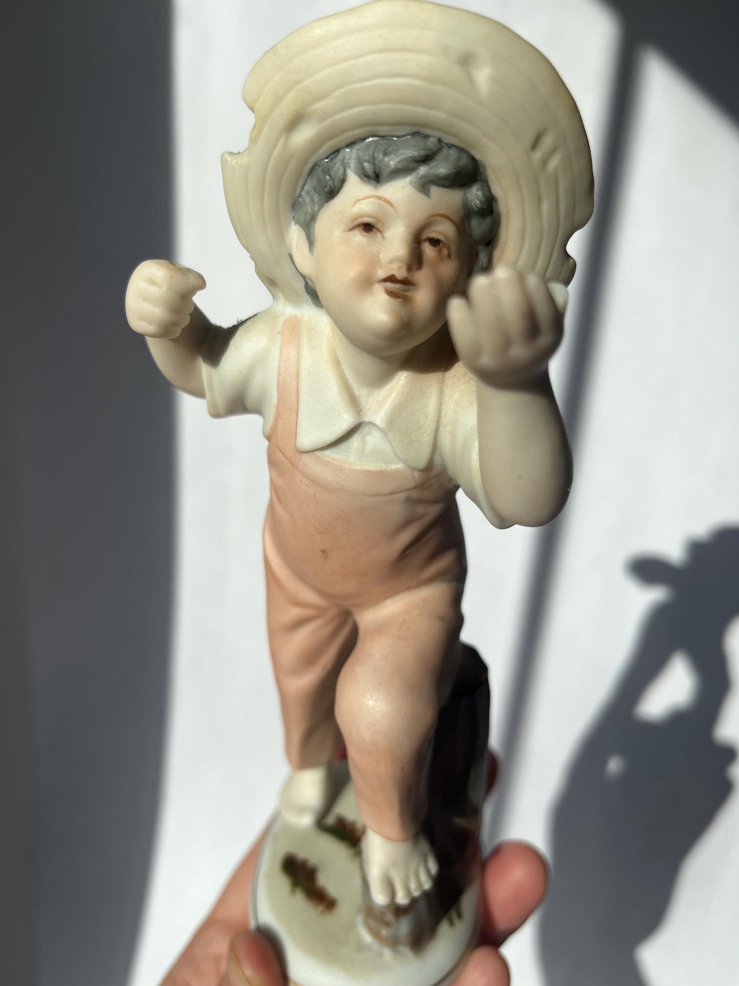 Vintage ceramic figurine of a boy, made in Japan