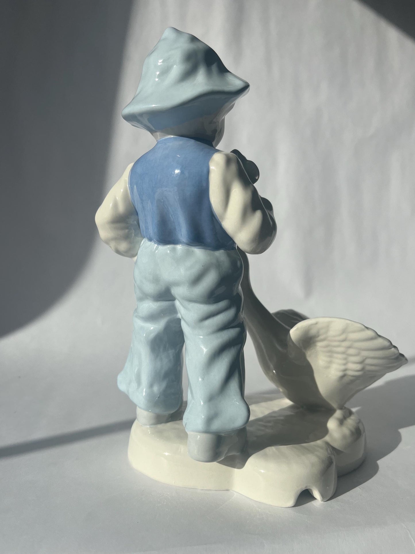 Vintage Porcelain Hand Painted Figurine of a Boy with a Goose