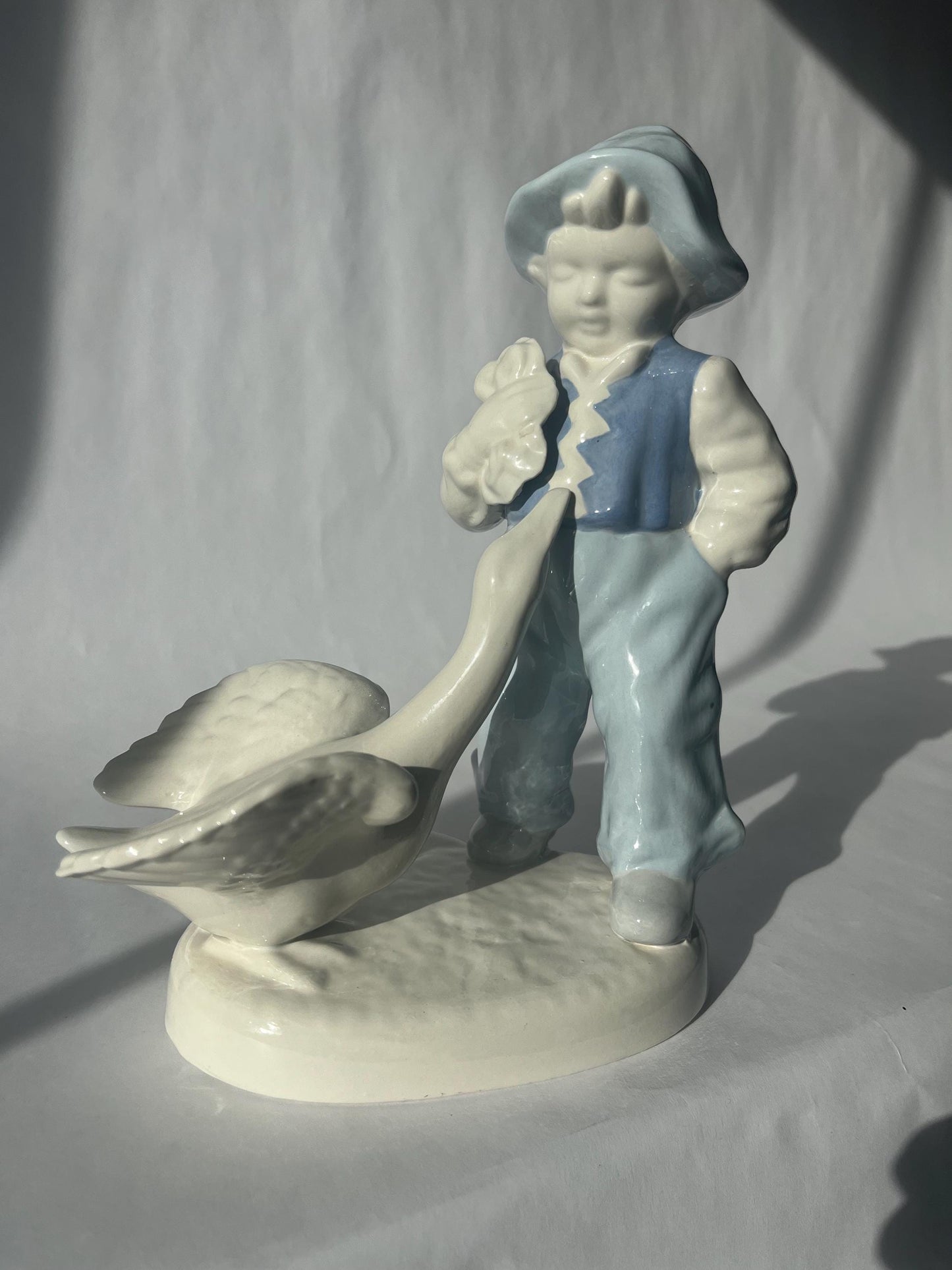 Vintage Porcelain Hand Painted Figurine of a Boy with a Goose