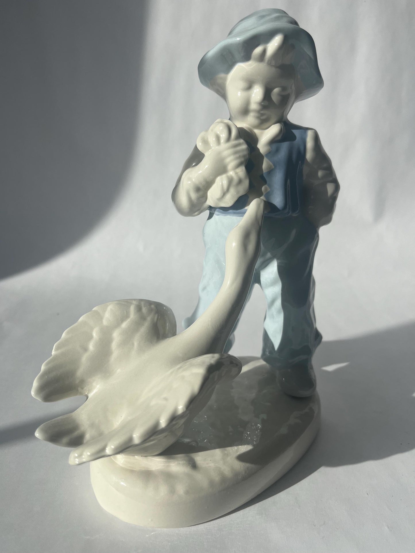 Vintage Porcelain Hand Painted Figurine of a Boy with a Goose