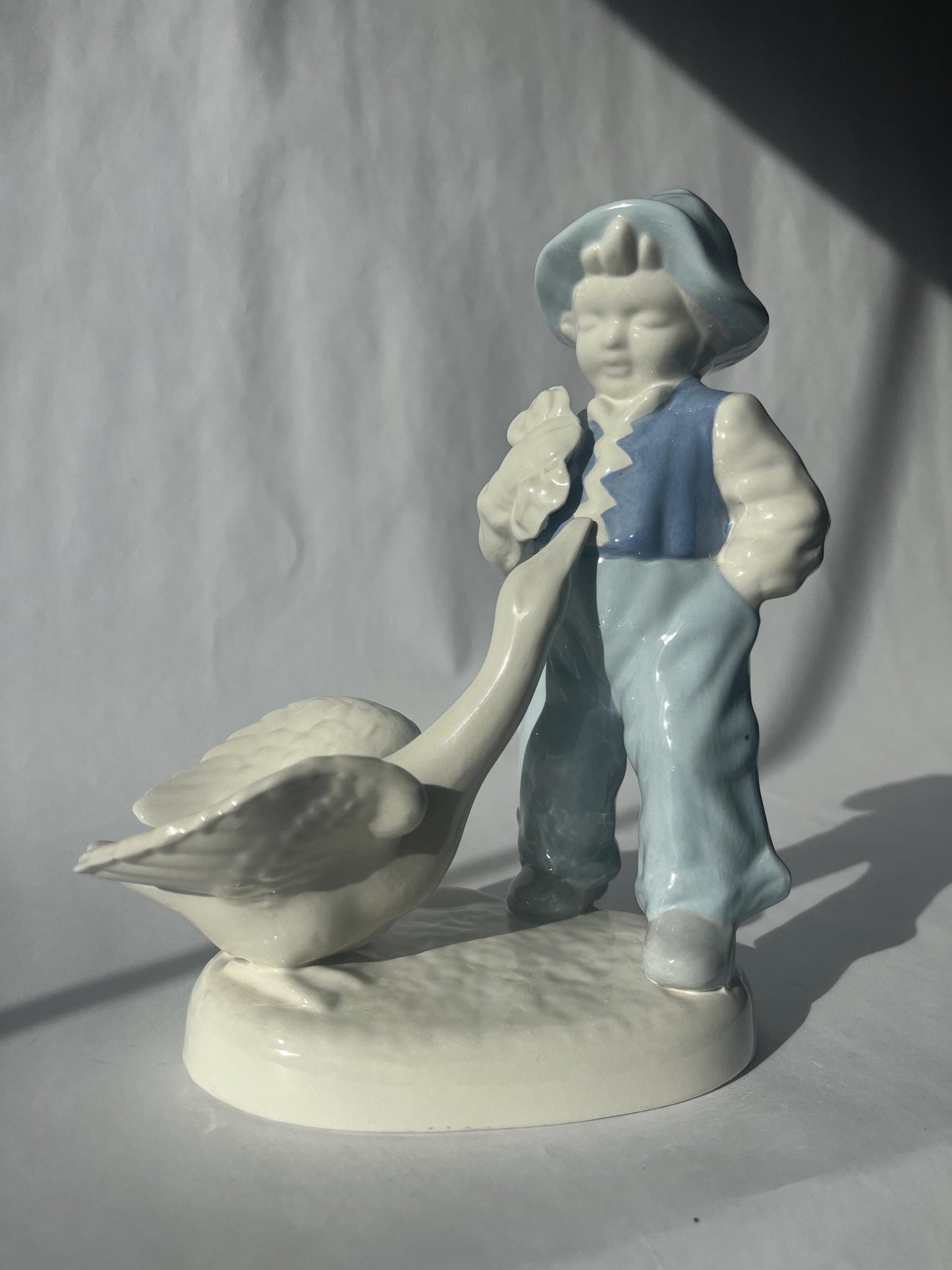 Vintage Porcelain Hand Painted Figurine of a Boy with a Goose