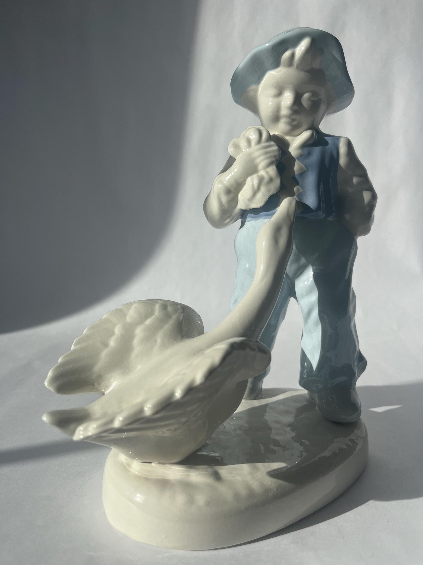 Vintage Porcelain Hand Painted Figurine of a Boy with a Goose