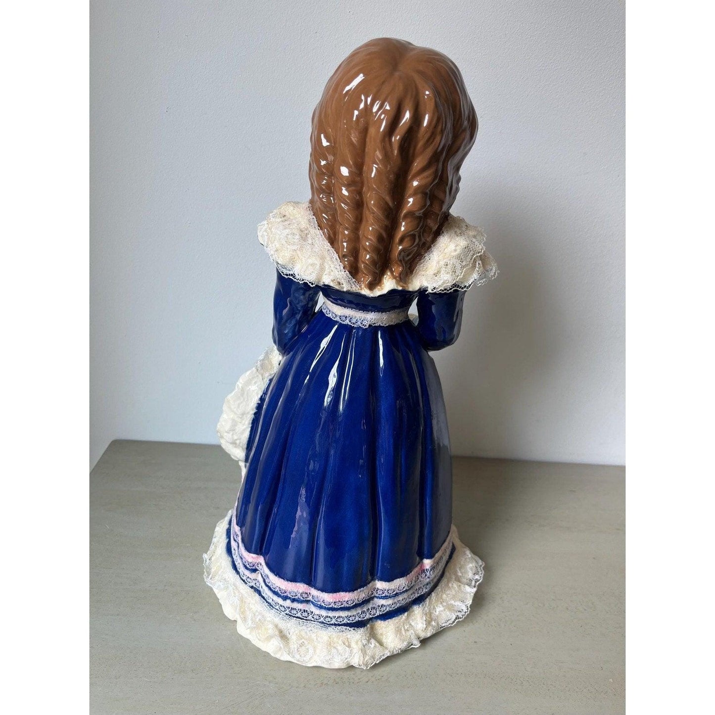 Vintage 14" ceramic figurine of a girl with a hat