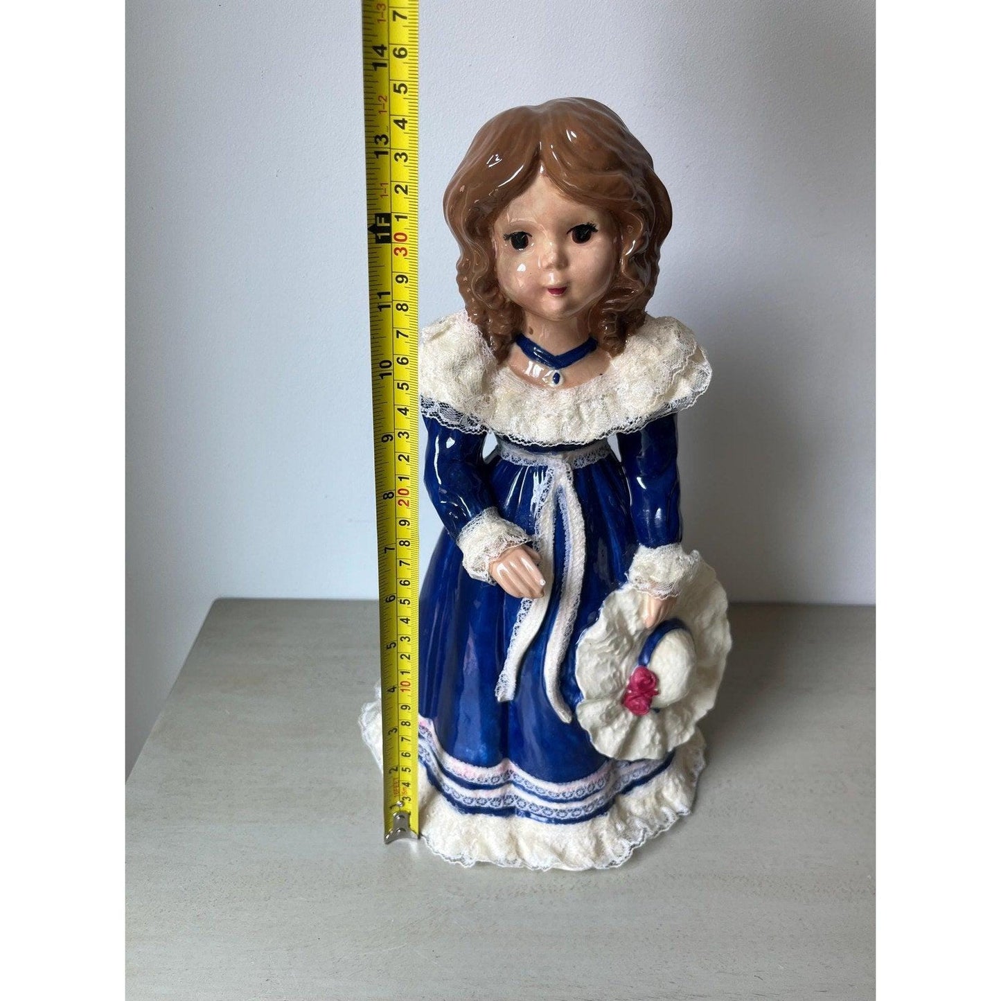 Vintage 14" ceramic figurine of a girl with a hat