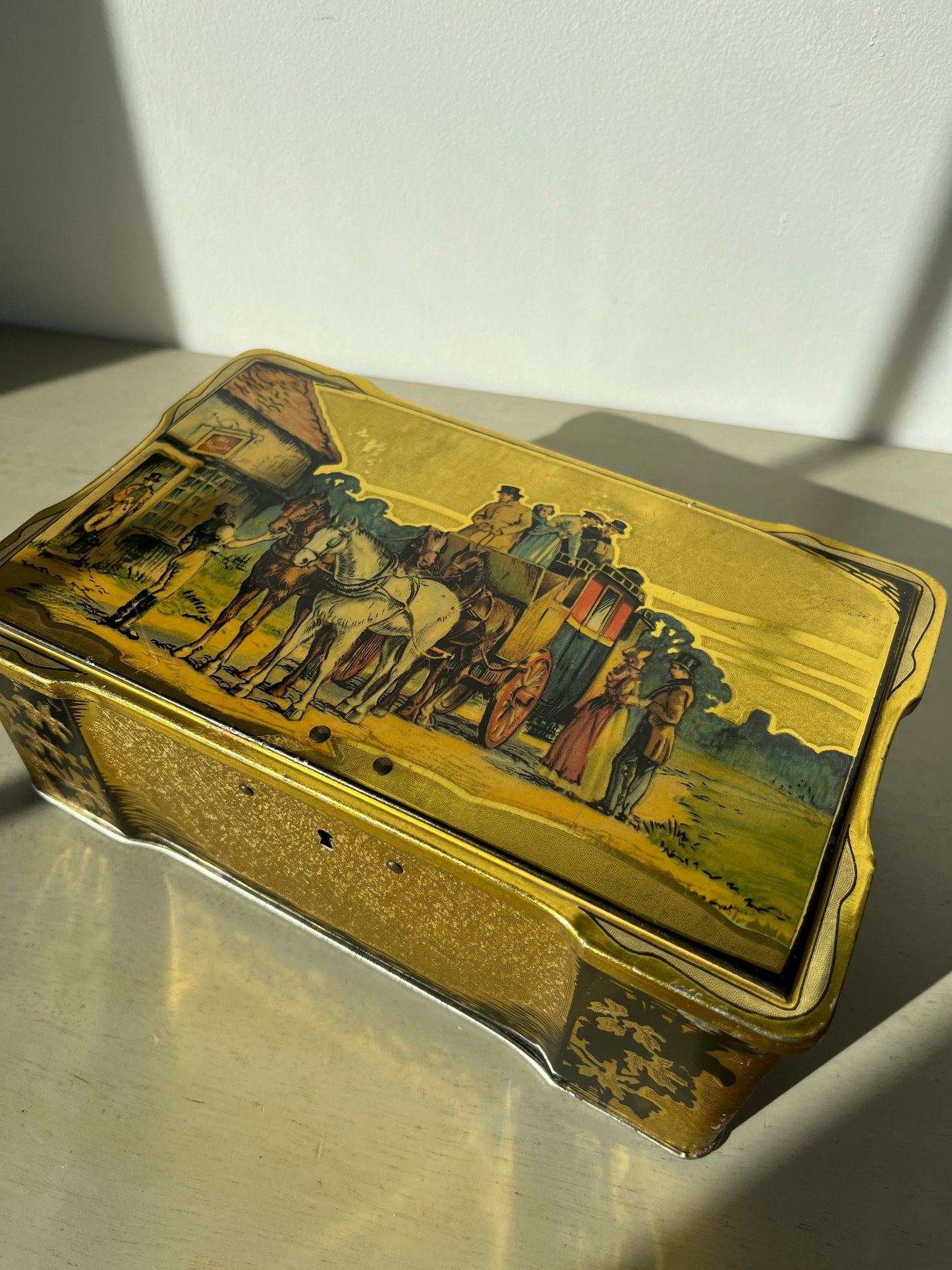Vintage English biscuits tin with a coaching scene