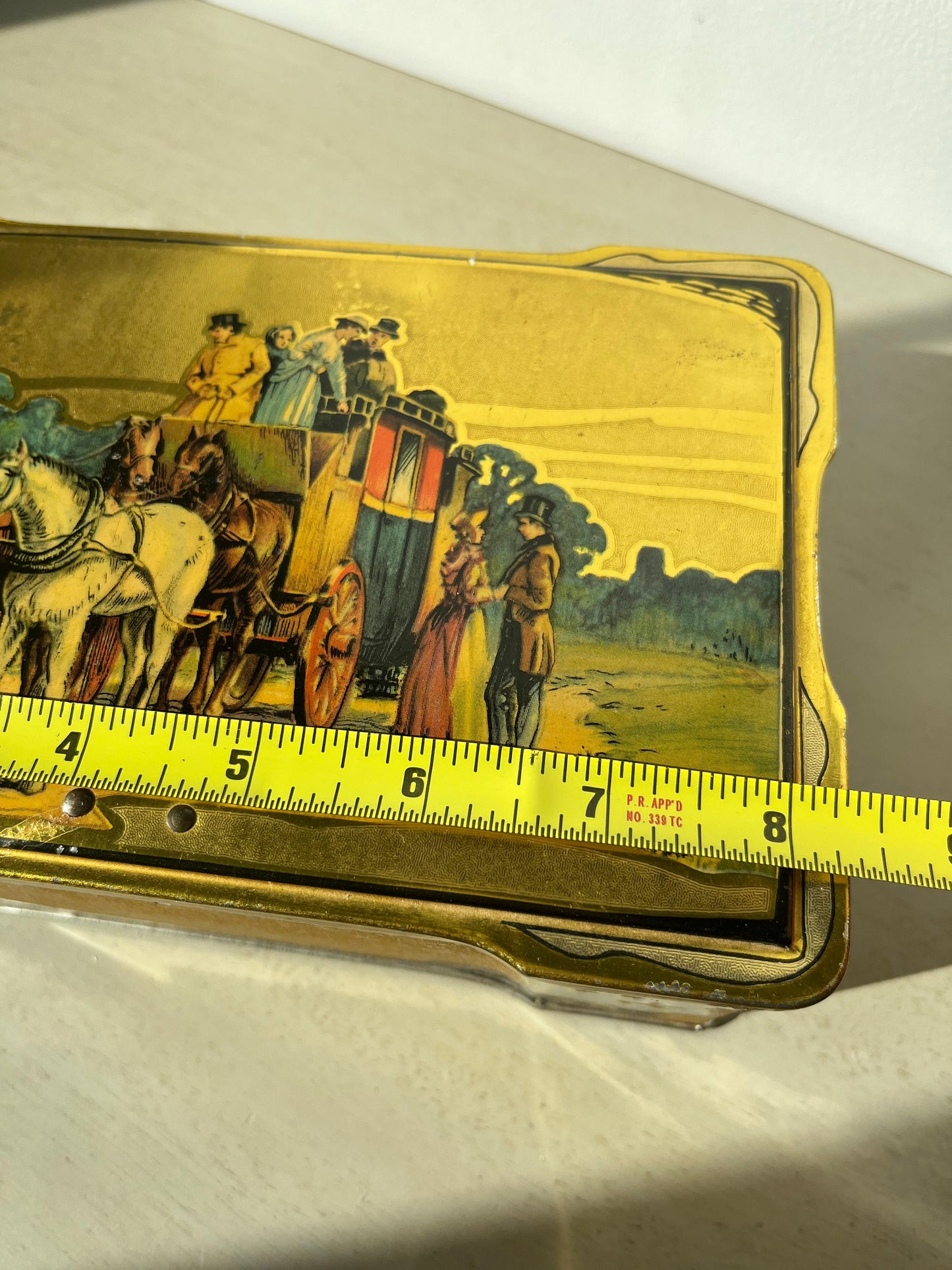 Vintage English biscuits tin with a coaching scene