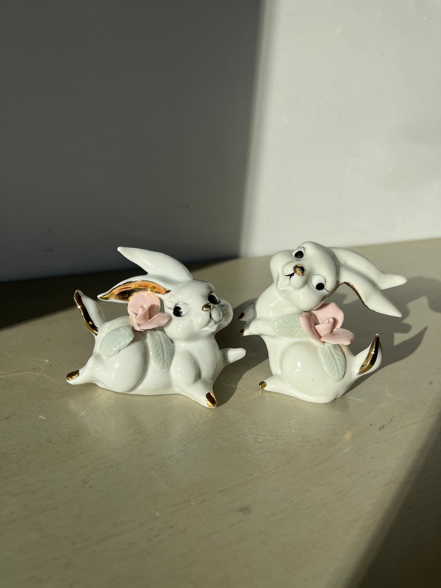 Vintage pair of white porcelain bunny rabbits, pink flowers & gold trim