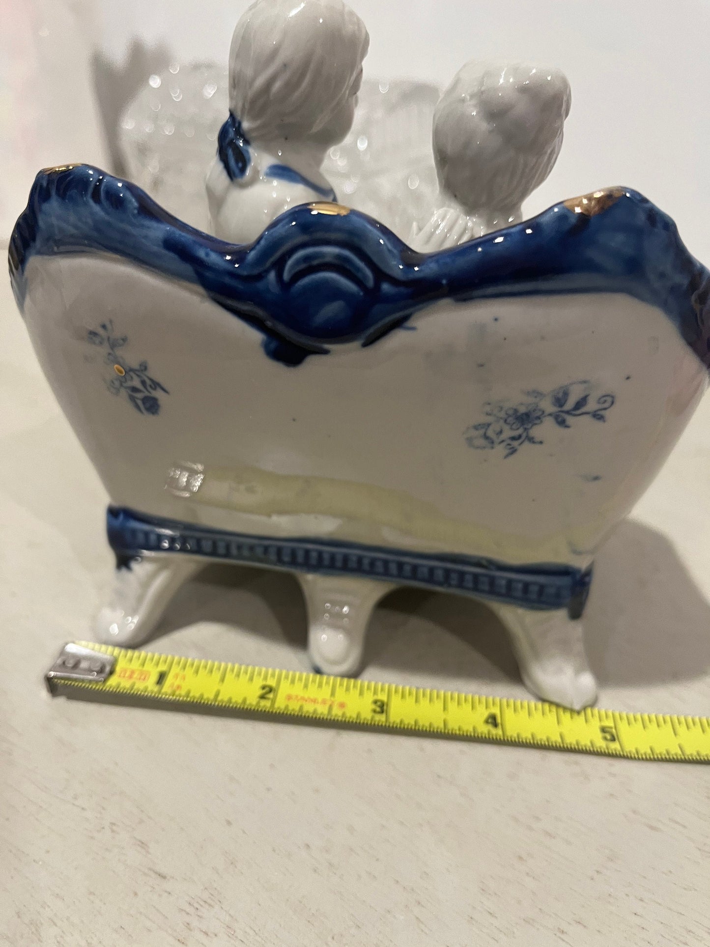 Vintage porcelain blue and white figurine of a courting 18th century couple