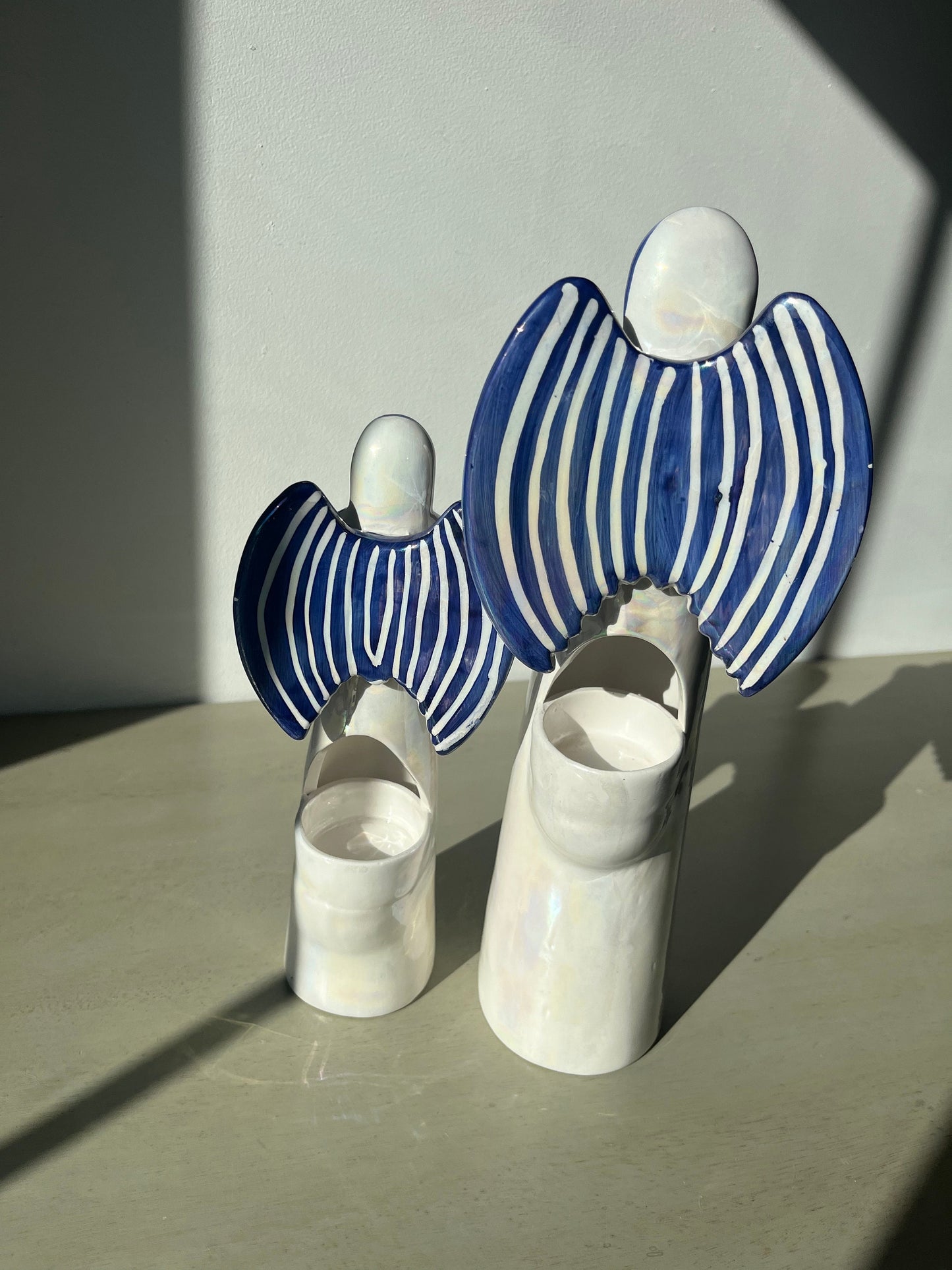 Pair of vintage iridescent glass blue pearl 12 & 9.5 inch angel candle holders