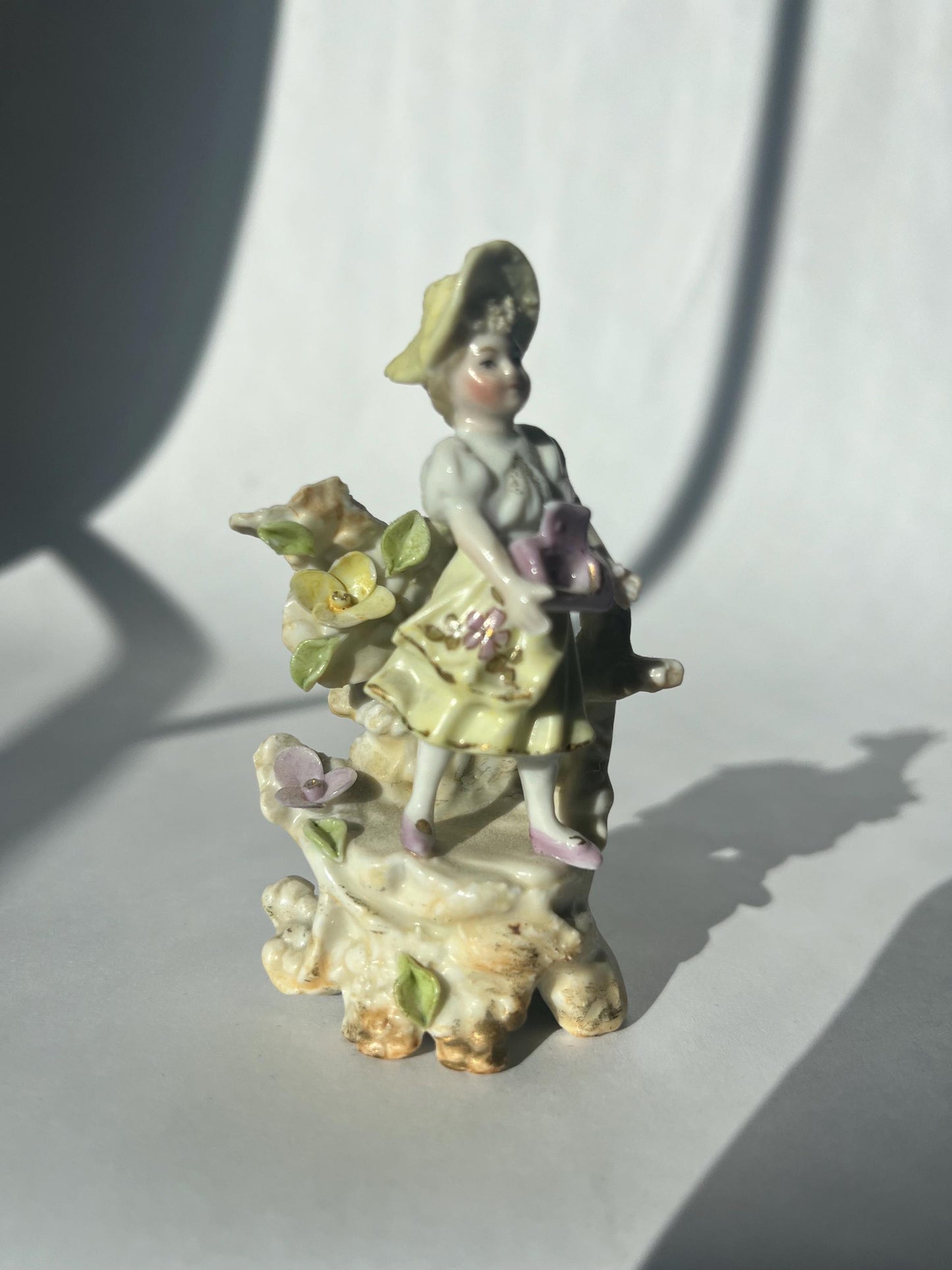 Antique mini porcelain figurine