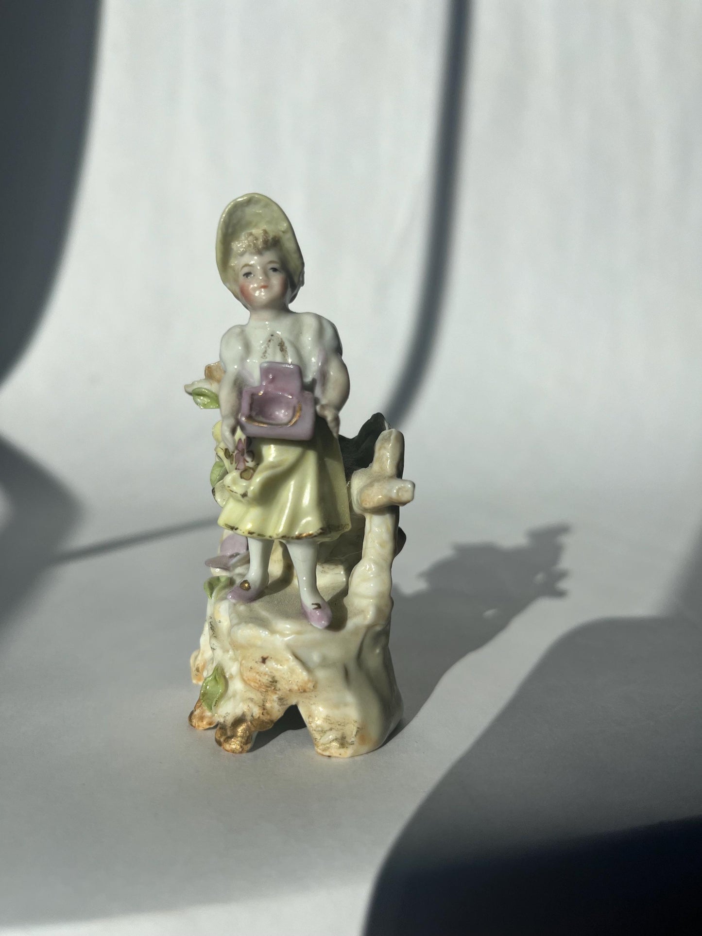Antique mini porcelain figurine
