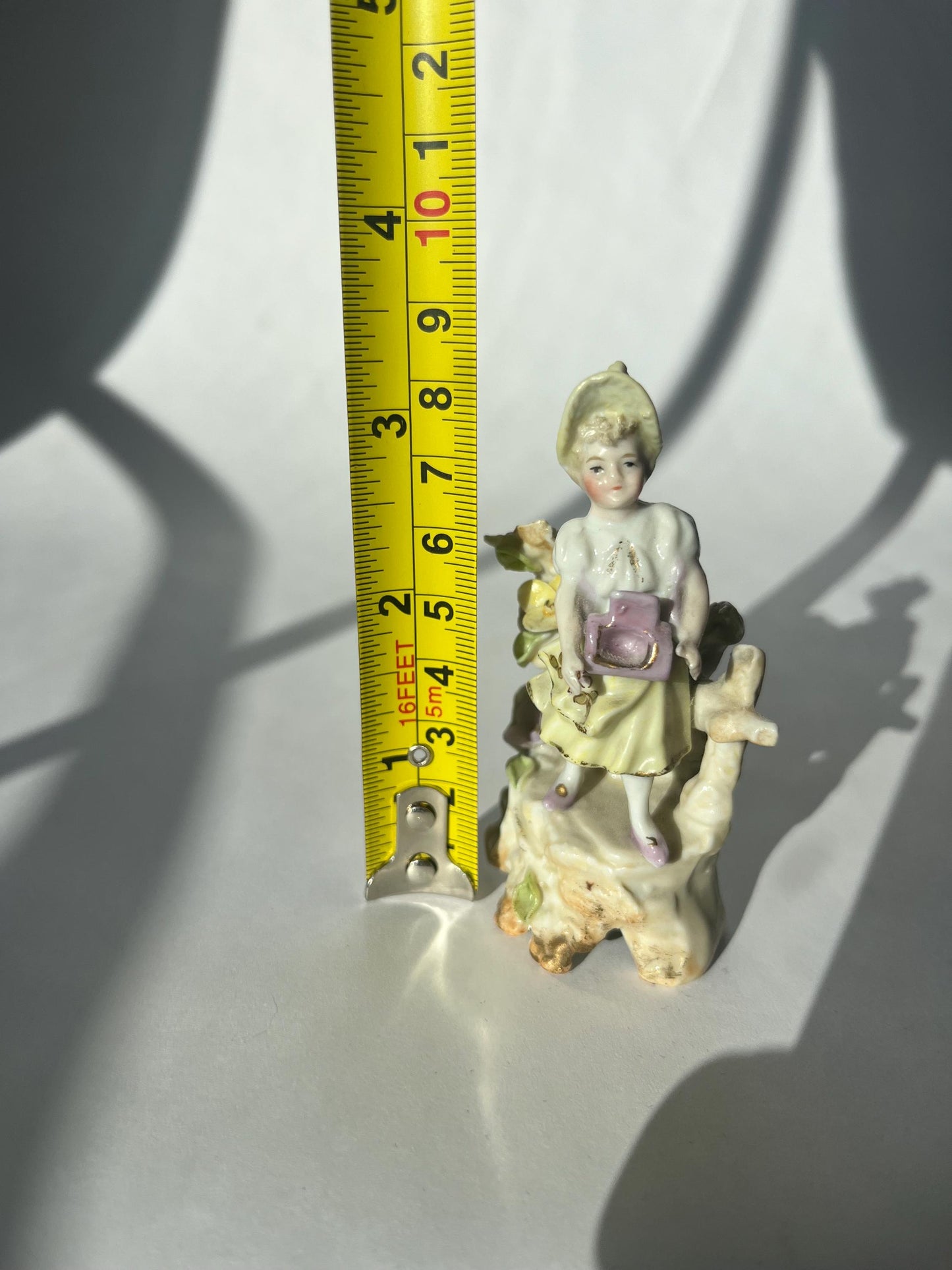 Antique mini porcelain figurine