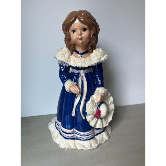 Vintage 14" ceramic figurine of a girl with a hat