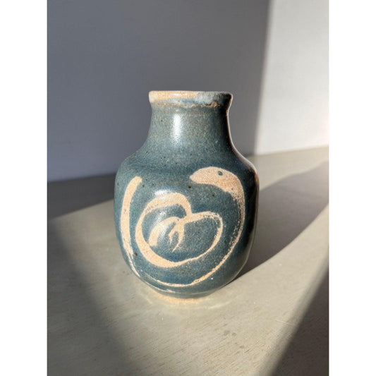 Vintage blue pottery vase with white ornaments