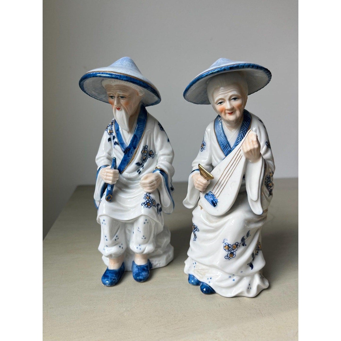 Pair of vintage porcelain Japanese musician figurines