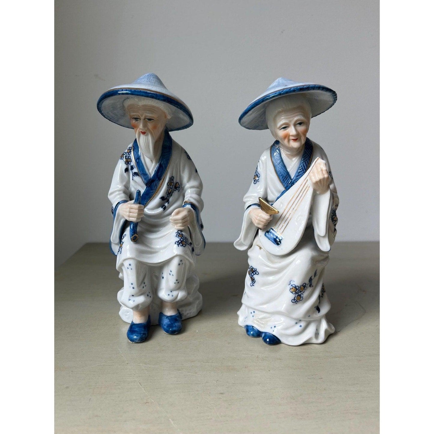 Pair of vintage porcelain Japanese musician figurines
