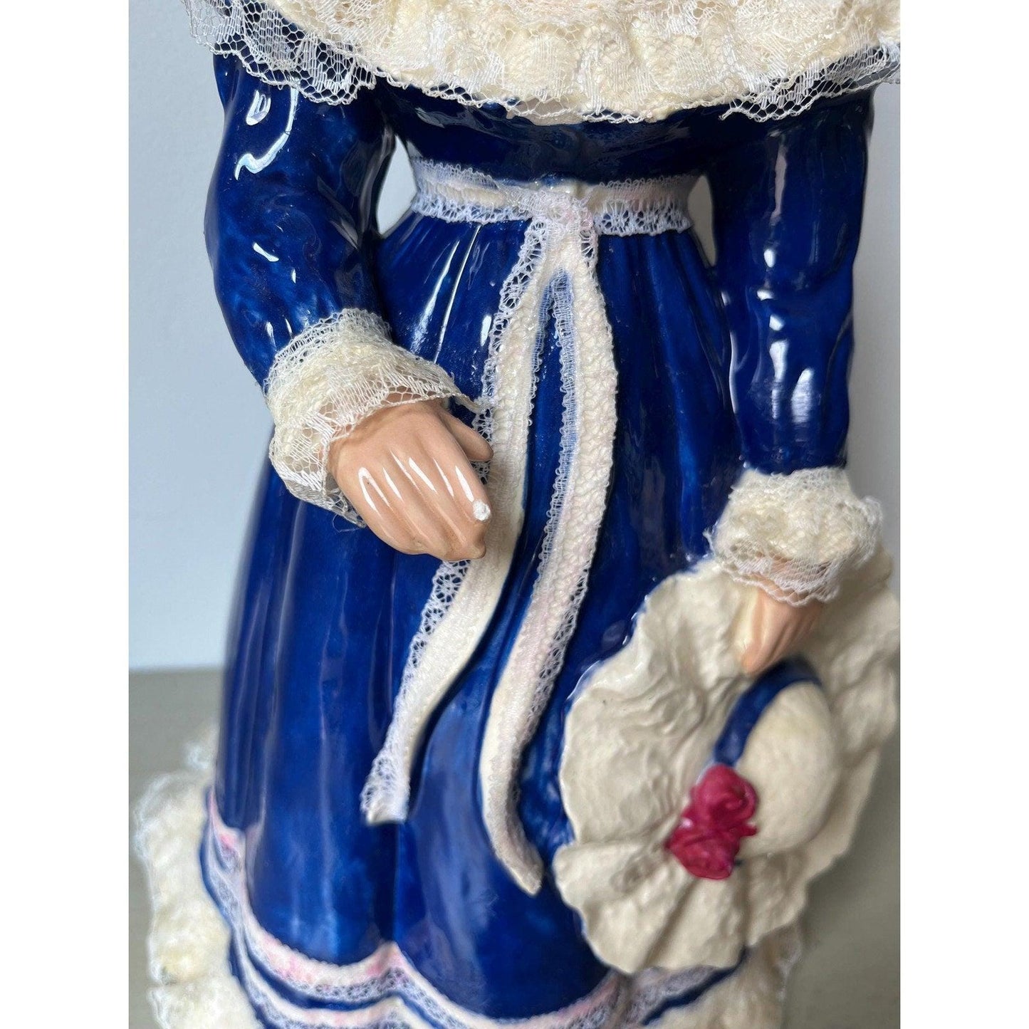 Vintage 14" ceramic figurine of a girl with a hat