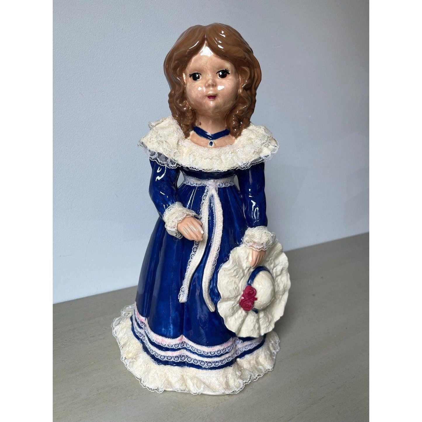 Vintage 14" ceramic figurine of a girl with a hat