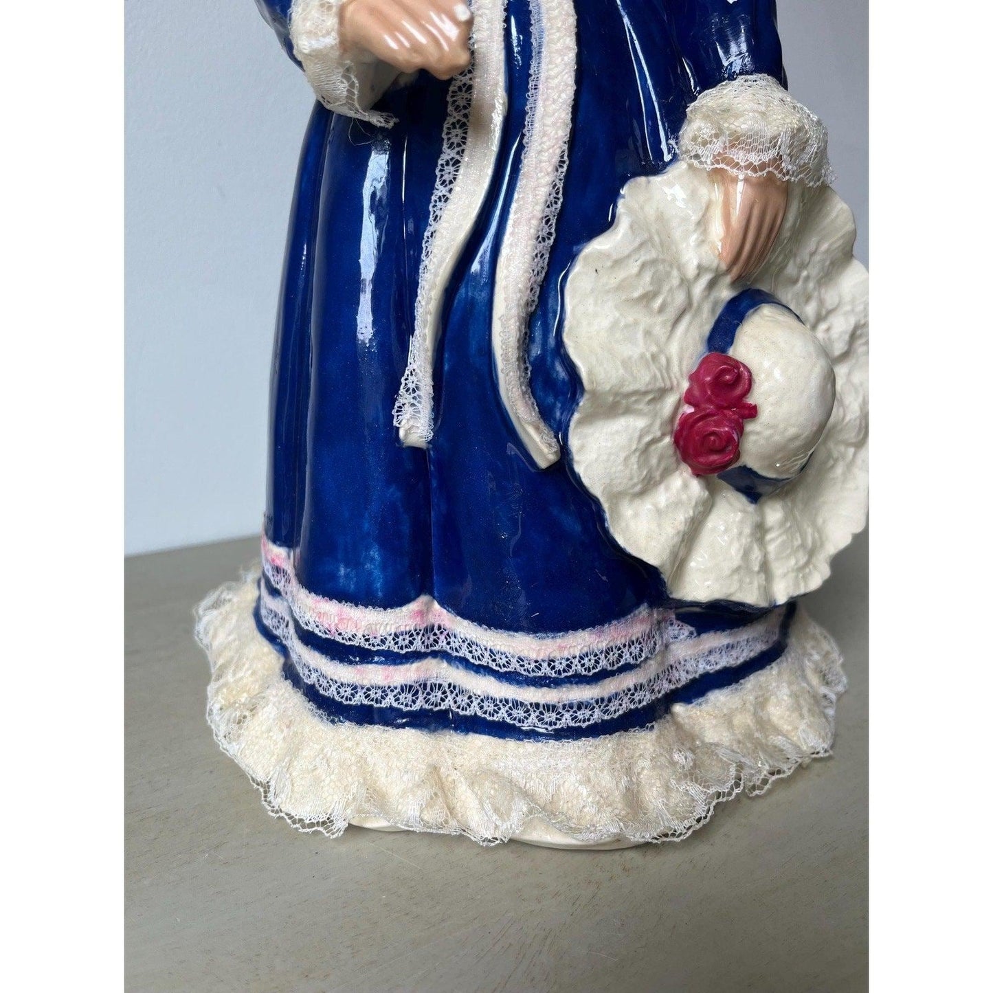 Vintage 14" ceramic figurine of a girl with a hat