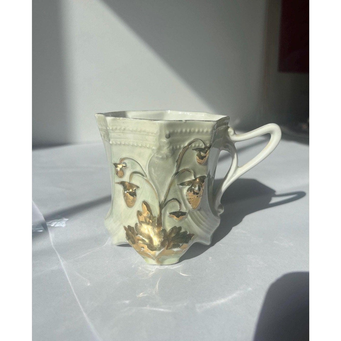 Antique hand painted porcelain cup