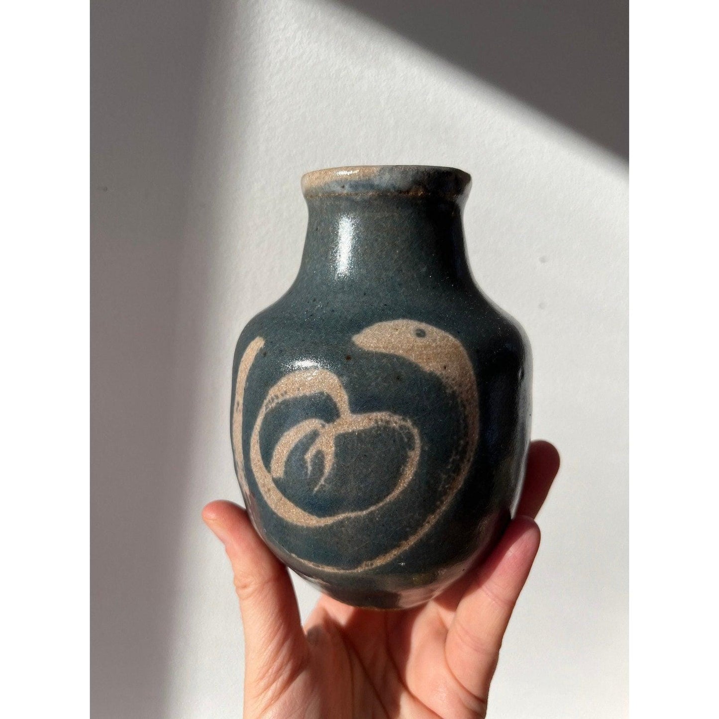 Vintage blue pottery vase with white ornaments