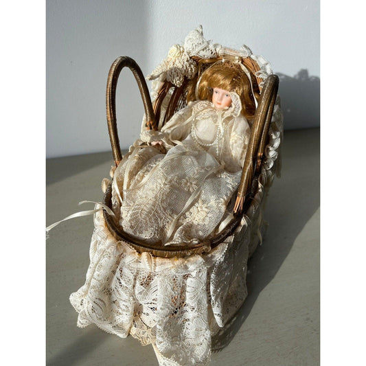 Vintage doll in a wicker basket with lace