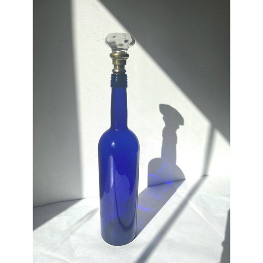 Vintage cobalt blue glass bottle with glass cork stopper
