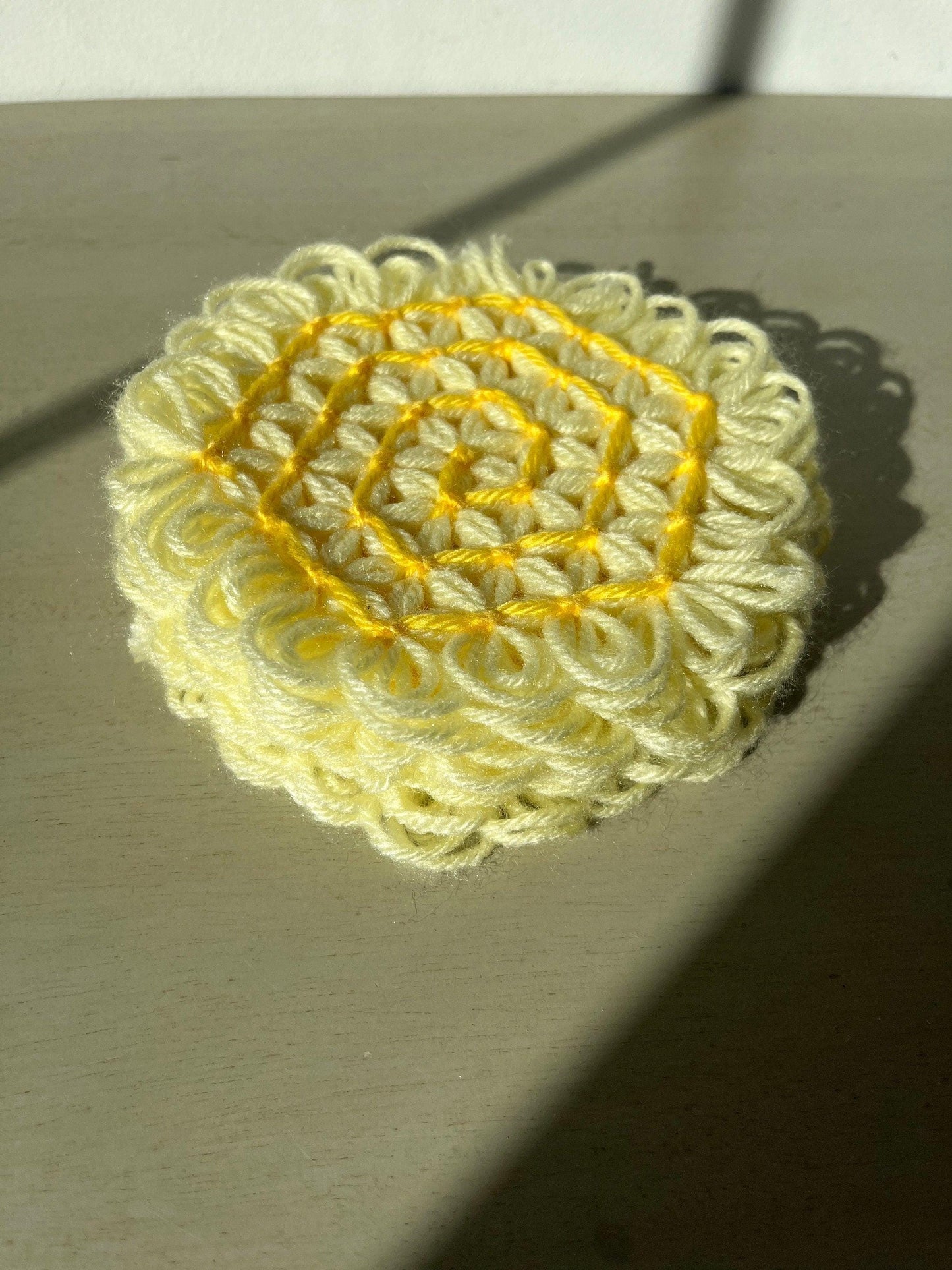Vintage yellow crocheted coasters